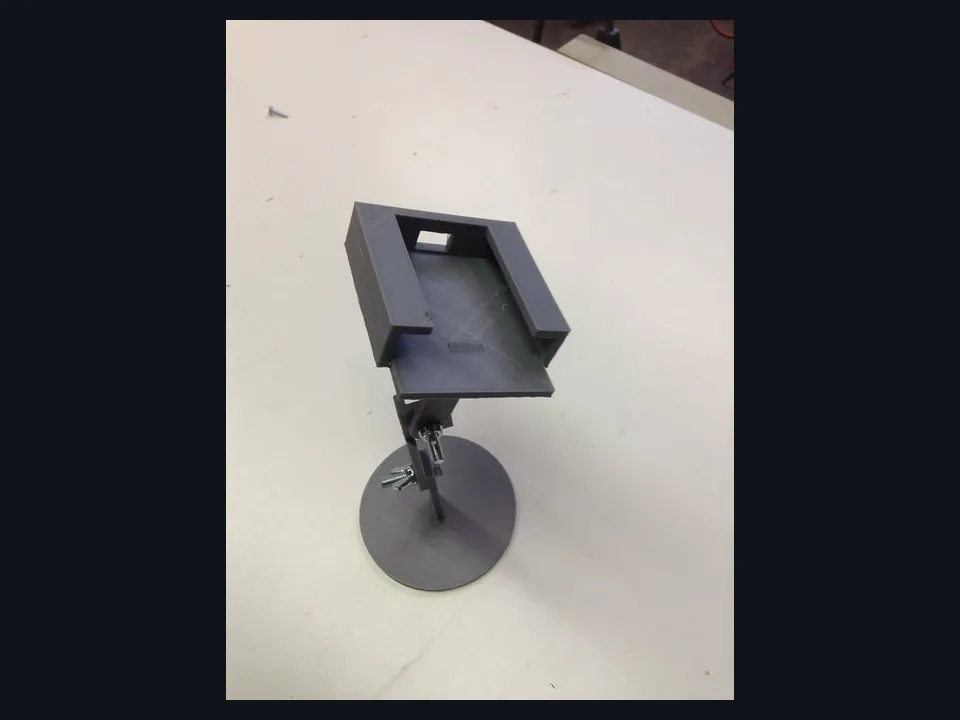 Referência visual de um suporte de mesa para celular